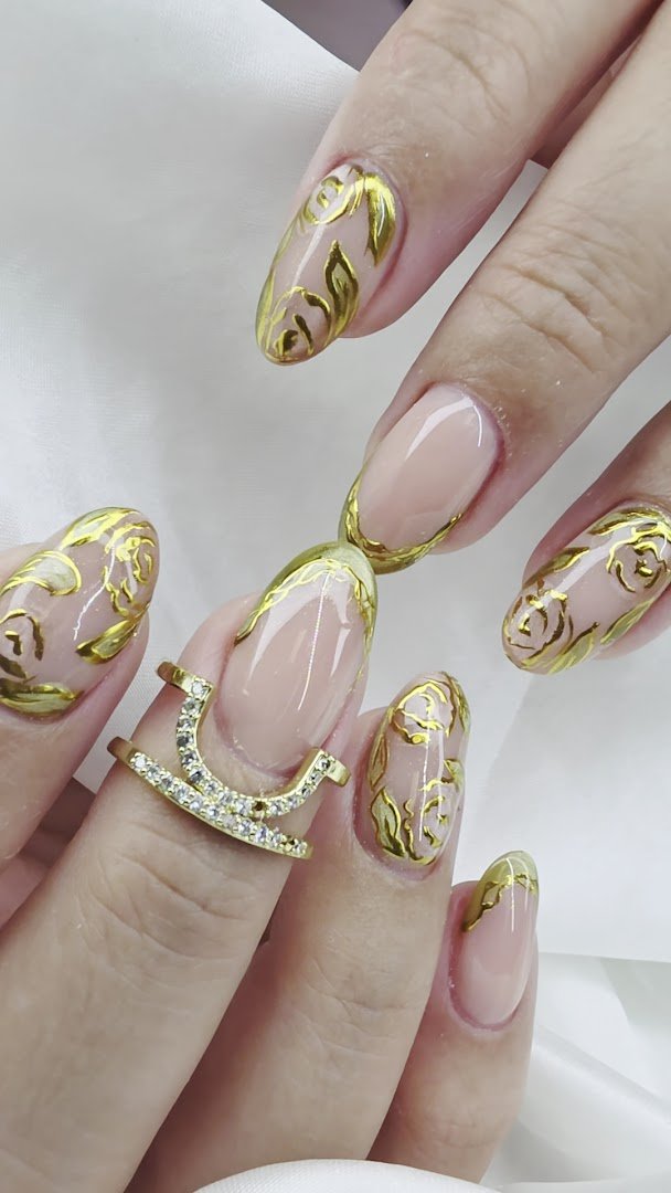 Close-up of detailed nail art on natural nails